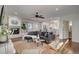 Bright living room with hardwood floors, a fireplace, and a comfortable gray sectional sofa at 3434 S Race St, Englewood, CO 80113