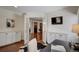 Bright home office with hardwood floors, built-in cabinets, and a mounted flatscreen TV at 3434 S Race St, Englewood, CO 80113