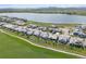 Aerial view of the homes, lake, and green space in the community at 2932 Heron Lakes Pkwy, Berthoud, CO 80513