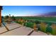 View from the patio of the community lawn and mountain range skyline at 2932 Heron Lakes Pkwy, Berthoud, CO 80513