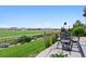 This patio has a view of the lawn, community, and wrought iron fencing at 2932 Heron Lakes Pkwy, Berthoud, CO 80513