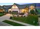 Beautiful home featuring lush landscaping, a well-kept lawn, and a spacious driveway, offering curb appeal at 2932 Heron Lakes Pkwy, Berthoud, CO 80513