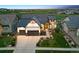 Charming home with a three-car garage, professional landscaping and a sprawling green lawn at 2932 Heron Lakes Pkwy, Berthoud, CO 80513