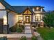 Inviting home exterior with a beautifully landscaped front yard and charming entry, showcasing quality craftsmanship at 2932 Heron Lakes Pkwy, Berthoud, CO 80513