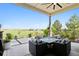 Beautifully arranged patio with outdoor seating and stunning views of the surrounding landscape at 2932 Heron Lakes Pkwy, Berthoud, CO 80513