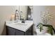 Stylish powder room with a vessel sink, decorative mirror, and modern accents at 2932 Heron Lakes Pkwy, Berthoud, CO 80513