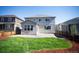 Exterior of home featuring a well-manicured lawn and mulch at 7812 Blue Water Ln, Castle Rock, CO 80108