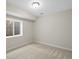 Basement bedroom with neutral walls, plush carpet, and a small window at 7812 Blue Water Ln, Castle Rock, CO 80108