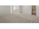 Spacious finished basement featuring neutral carpeting and easy access to additional rooms and bathroom at 7812 Blue Water Ln, Castle Rock, CO 80108