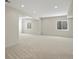 Large basement with neutral carpet, recessed lighting, and egress windows at 7812 Blue Water Ln, Castle Rock, CO 80108