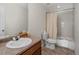 Bathroom featuring a vanity, mirror, toilet, and bathtub with shower at 7812 Blue Water Ln, Castle Rock, CO 80108