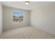 Carpeted bedroom with a window, offering ample natural light and neighborhood views at 7812 Blue Water Ln, Castle Rock, CO 80108