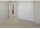 Bedroom with neutral carpet, closet with sliding doors, and a view to another room at 7812 Blue Water Ln, Castle Rock, CO 80108