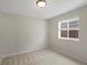 Bedroom with neutral walls, plush carpet, and a window that provide natural light at 7812 Blue Water Ln, Castle Rock, CO 80108