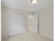 Cozy bedroom with large closet and doorway that leads to another room at 7812 Blue Water Ln, Castle Rock, CO 80108