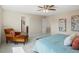 Bedroom with ceiling fan and sitting area, leads into ensuite bathroom at 7812 Blue Water Ln, Castle Rock, CO 80108