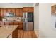 Kitchen featuring stainless steel appliances, granite countertops, and an extra large side-by-side refrigerator at 7812 Blue Water Ln, Castle Rock, CO 80108