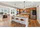 Stunning eat-in kitchen with granite countertops, stainless steel appliances, and hardwood floors at 7812 Blue Water Ln, Castle Rock, CO 80108