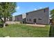 Backyard with a brick patio and a wooden fence at 9690 Lansing Cir, Commerce City, CO 80022