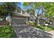 Lovely two-story home featuring a spacious driveway, attached two-car garage, and beautifully landscaped front yard at 9690 Lansing Cir, Commerce City, CO 80022