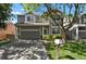 Charming two-story home with a gray exterior, two-car garage, and well-maintained front yard at 9690 Lansing Cir, Commerce City, CO 80022