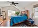 Bright bedroom with vaulted ceilings, a large window, and a comfortable king-size bed at 25850 E 3Rd Ave, Aurora, CO 80018