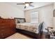Bedroom with hardwood floors, ceiling fan, natural light from a window, and modern furnishings at 25850 E 3Rd Ave, Aurora, CO 80018