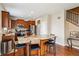 Spacious kitchen island with barstool seating and modern stainless steel appliances at 25850 E 3Rd Ave, Aurora, CO 80018