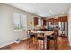 Bright kitchen with a large island, stainless steel appliances, and wooden cabinets at 25850 E 3Rd Ave, Aurora, CO 80018