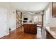 Open-concept kitchen features a granite island and stainless steel appliances, perfect for modern living at 25850 E 3Rd Ave, Aurora, CO 80018