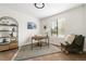 Bright bedroom featuring neutral walls, a large window, and a cozy reading corner at 5991 W 68Th Ave, Arvada, CO 80003