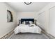Cozy bedroom with blue headboard, plush rug, and ample closet space at 5991 W 68Th Ave, Arvada, CO 80003