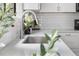 Close-up of the kitchen sink with quartz countertop and modern faucet at 5991 W 68Th Ave, Arvada, CO 80003