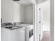 Convenient laundry room features modern appliances and ample space for sorting and folding at 5991 W 68Th Ave, Arvada, CO 80003