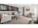 Inviting living room with comfortable seating, modern decor, and stairs leading to the next level at 5991 W 68Th Ave, Arvada, CO 80003
