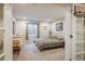 Finished basement bedroom with soft natural light at 1038 Petras St, Erie, CO 80516