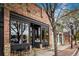 Charming brick bistro exterior with outdoor seating and large windows at 1038 Petras St, Erie, CO 80516