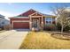 Inviting single-Gathering home featuring a two-car garage and a well-maintained front yard at 1038 Petras St, Erie, CO 80516