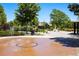 Community splash pad with water features, perfect for summer fun at 1038 Petras St, Erie, CO 80516