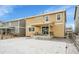 Backyard view of a home with a covered patio and fenced yard at 4733 S Wenatchee Cir, Aurora, CO 80015