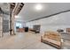 Unfinished basement with concrete floors, exposed ceiling, and good natural lighting at 4733 S Wenatchee Cir, Aurora, CO 80015