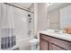 This bathroom features a tub with shower and a single sink vanity at 4733 S Wenatchee Cir, Aurora, CO 80015