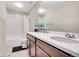This well lit bathroom features a double sink vanity and shower/tub combo at 4733 S Wenatchee Cir, Aurora, CO 80015