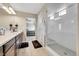 Open concept bathroom with shower and dual vanity at 4733 S Wenatchee Cir, Aurora, CO 80015