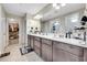 The bathroom features a double sink vanity, walk in closet, and a walk-in shower at 4733 S Wenatchee Cir, Aurora, CO 80015