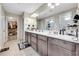 Bright bathroom with dual vanity, and walk-in closet at 4733 S Wenatchee Cir, Aurora, CO 80015