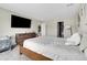 This bedroom has a dresser with a TV and a play area at 4733 S Wenatchee Cir, Aurora, CO 80015