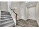 Spacious entryway with wood floors and a staircase leading to the upper level at 4733 S Wenatchee Cir, Aurora, CO 80015