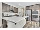 Kitchen island featuring stainless steel appliances and modern finishes at 4733 S Wenatchee Cir, Aurora, CO 80015