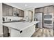 Kitchen with a large island, stainless steel appliances, and shaker cabinets at 4733 S Wenatchee Cir, Aurora, CO 80015